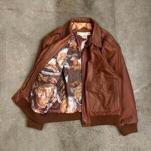 Tan leather bomber jacket by